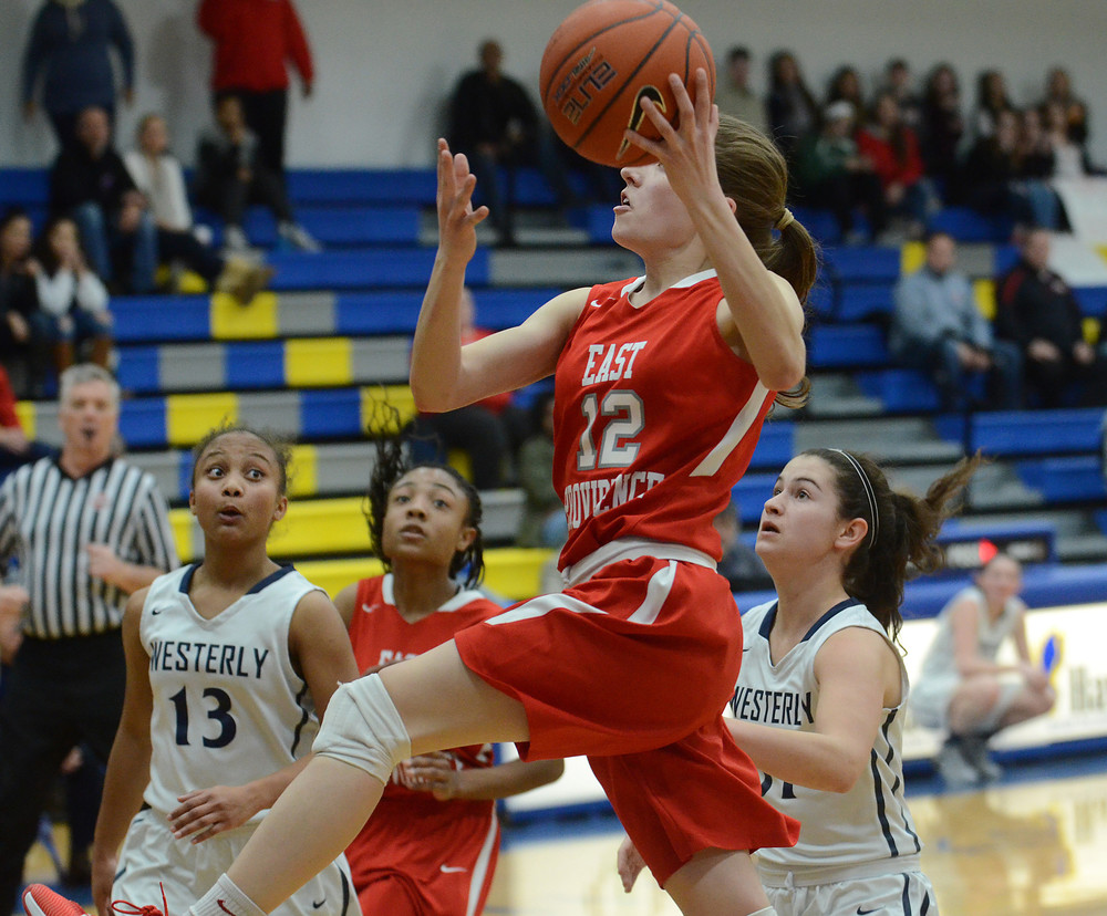 Junior guard Lily Conti soars to the hoop for two in the first half.