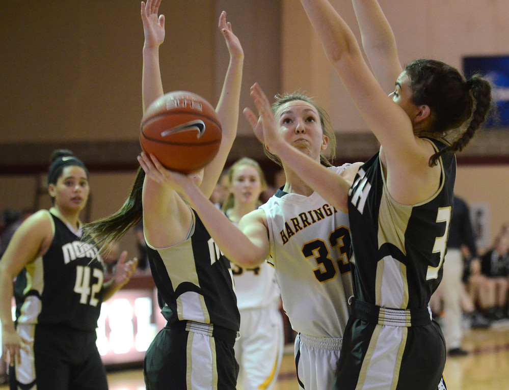 Junior forward Glory Ellison squeezes through North Kingstown defenders for a layup during the second half.