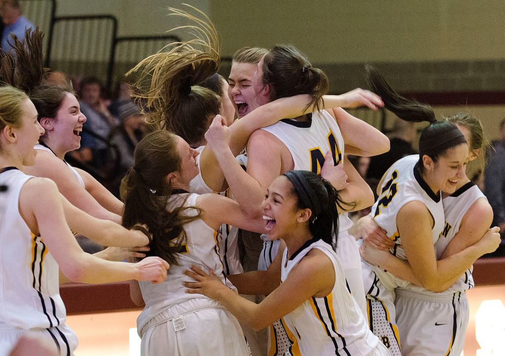 The Lady Eagles celebrate after beating LaSalle 39-36 in the Division I championship at RIC on Saturday evening.