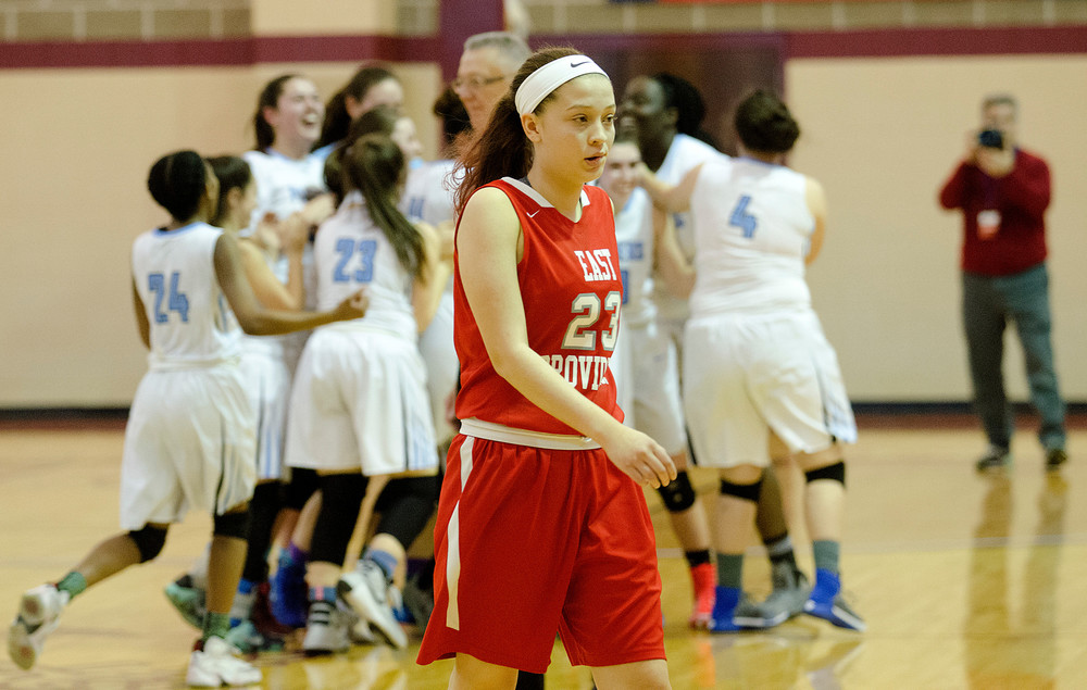 Townies forward Hailey Hannon walks off the court as Johnston celebrates after winning the D-II championship.