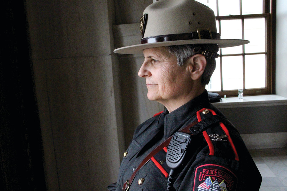 KEEPING WATCH: Colonel Ann Assumpico, Superintendent of the Rhode Island State Police and Director of the Rhode Island Department of Public Safety, stood inside the State House keeping tabs on the happenings.