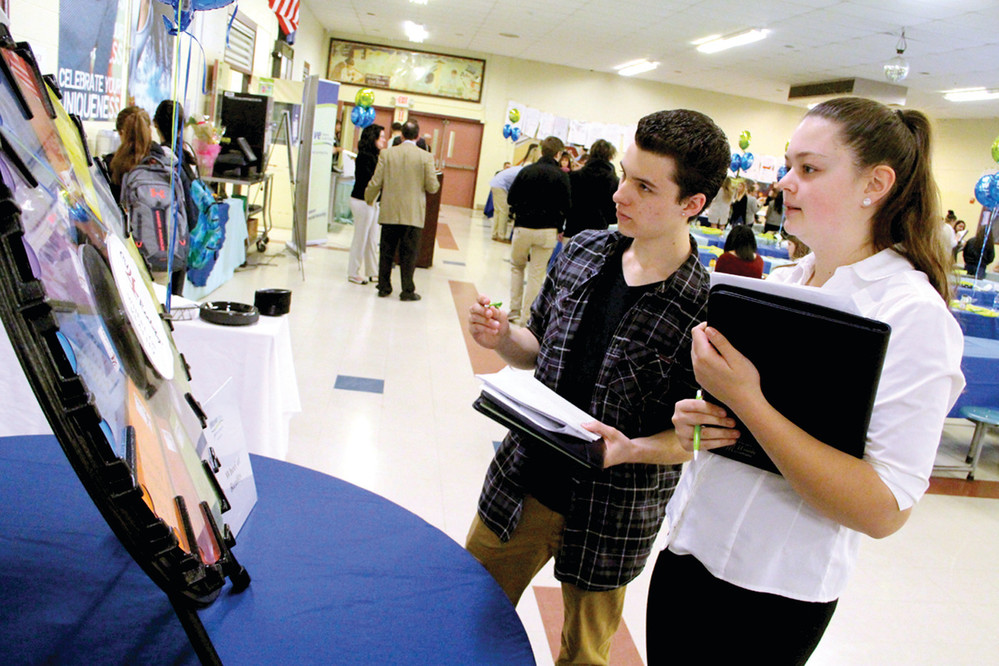 STICKING TO THE BASICS: Toll Gate senior Christian Woods and Eleanor West participated in the sixth annual CU 4 Reality Financial Education Fair held at the school Wednesday by Wave Credit Union. Their budgets didn&rsquo;t include any funds for vacations.