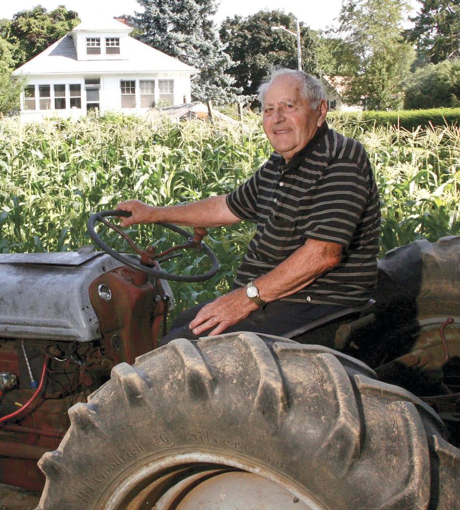 AT HOME: Anthony Soscia (above), who turned 100 on Saturday, holds farming as his passion. He worked on his farms until age 97.