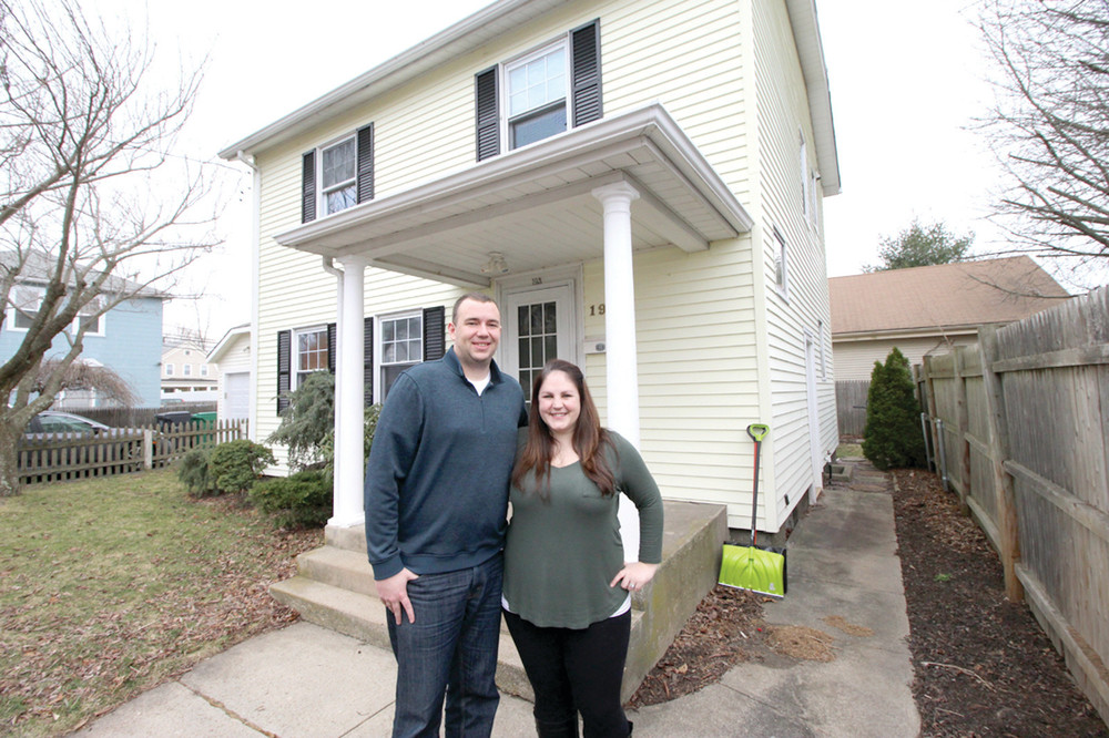 FIRST TIME HOME BUYERS: Greg and Taylor Flynn outside the home they bought last year.