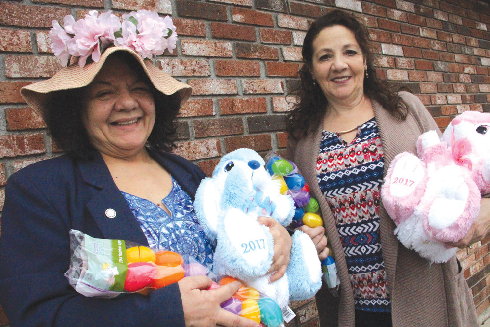 THREE DECADES: Decked in her Easter bonnet, Donna Travis is joined by Rita Oliver, chair of this year&rsquo;s Oakland Beach Association egg hunt. This year marks the hunt&rsquo;s 30th anniversary.
