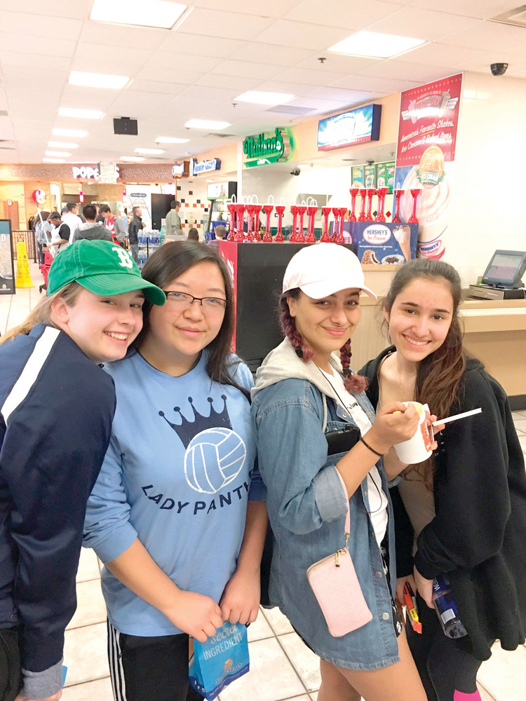 TAKING A BREAK: Kelsey Scott, Marilou Kue, Isabella Batista and Abigail Rain Heiser enjoy the first stop of their journey to Virginia, inside the restaurant at the Vince Lombardi Memorial Rest Stop off the New Jersey Turnpike.