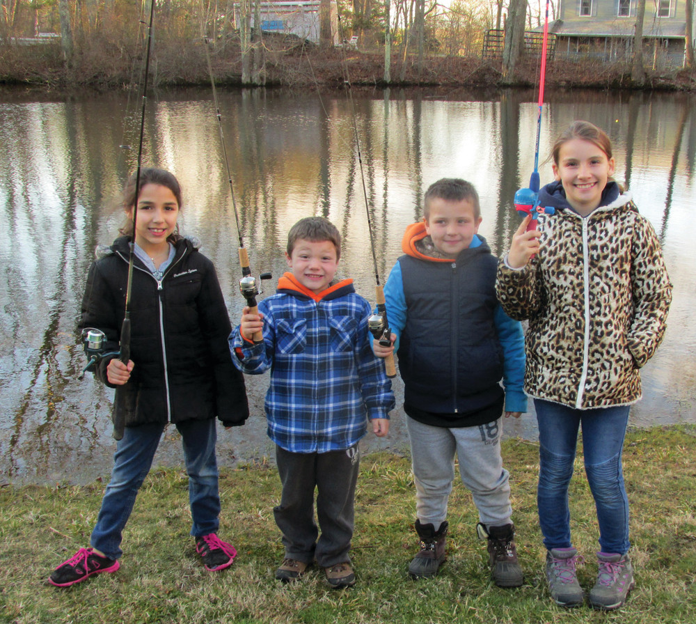 FISHING FUN: The Marks brothers &ndash; Camrin, 5, (second left) and Devin, 6 &ndash; are all smiles after arriving with friends Anna Gomes, 10, and Jaelynn Florio, 10, Saturday at Seidel&rsquo;s Sanctuary in Fiskeville.