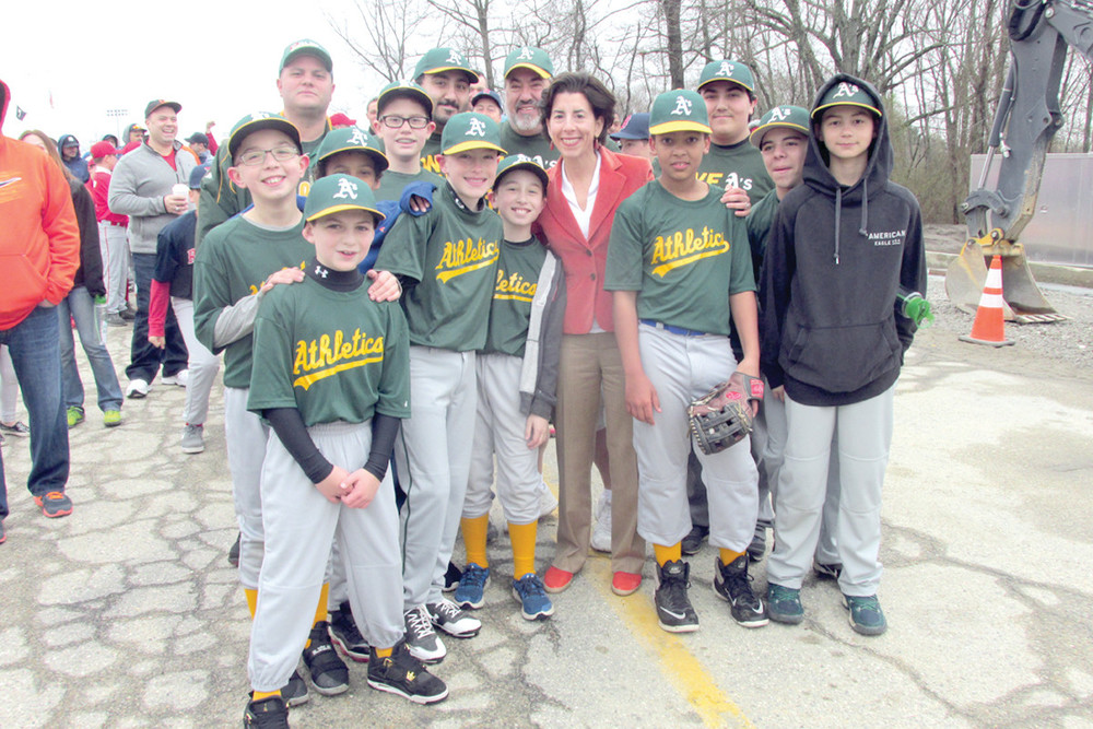 PLAY BALL: Rhode Island Gov. Gina Raimondo was the guest of honor for Saturday&rsquo;s 55th annual Johnston Little League Opening Day ceremony. Above, she&rsquo;s surrounded by the defending champion Athletics. They are now sponsored by County View Landscaping.