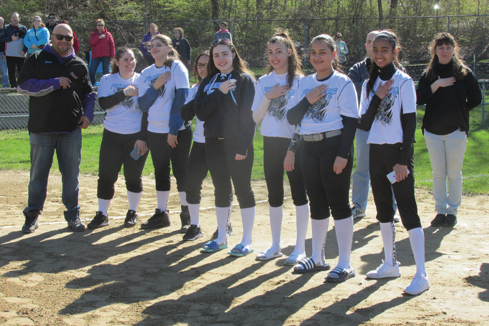 MIGHTY MOMENT: Like many of the 141 players who make up the JGSL, these girls from the 16U Division stand at attention and show their respect during the playing of the National Anthem at Sunday&rsquo;s season opening ceremony.