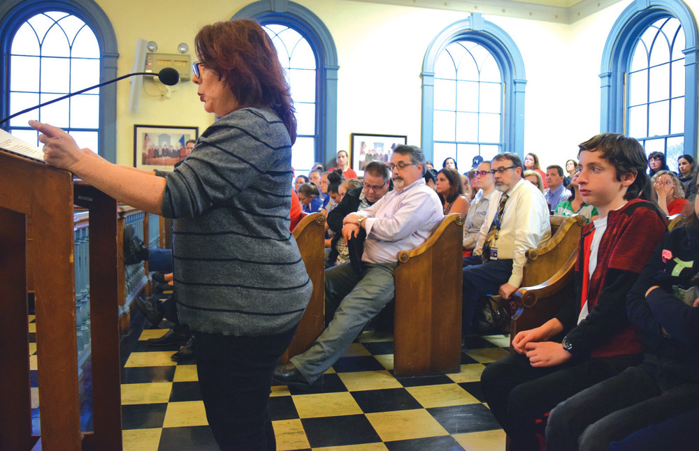 THE SIDES COME TOGETHER: School Committee Chairwoman Janice Ruggieri speaks before a packed Council.