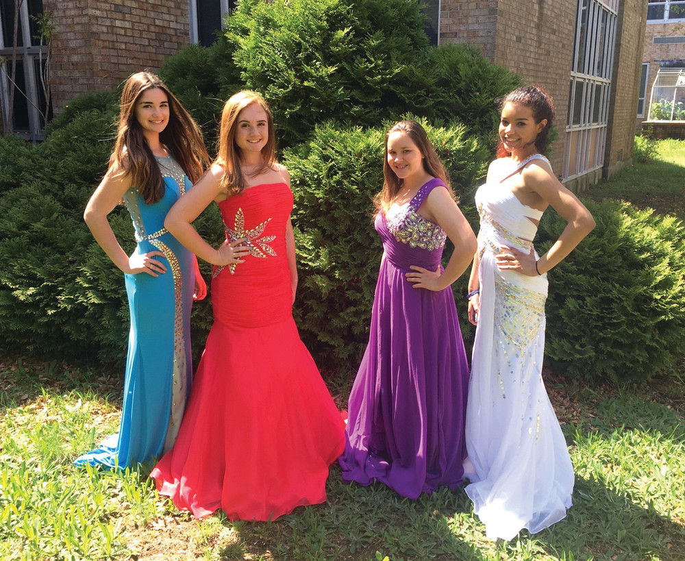 COVER GIRLS: Johnston High School Students Juliana Manchester, Fallon Davis, Marlaina Colardo and Daijah Bennet model a selection of dresses available to girls through Mrs. C&rsquo;s Dress Exchange at the high school.