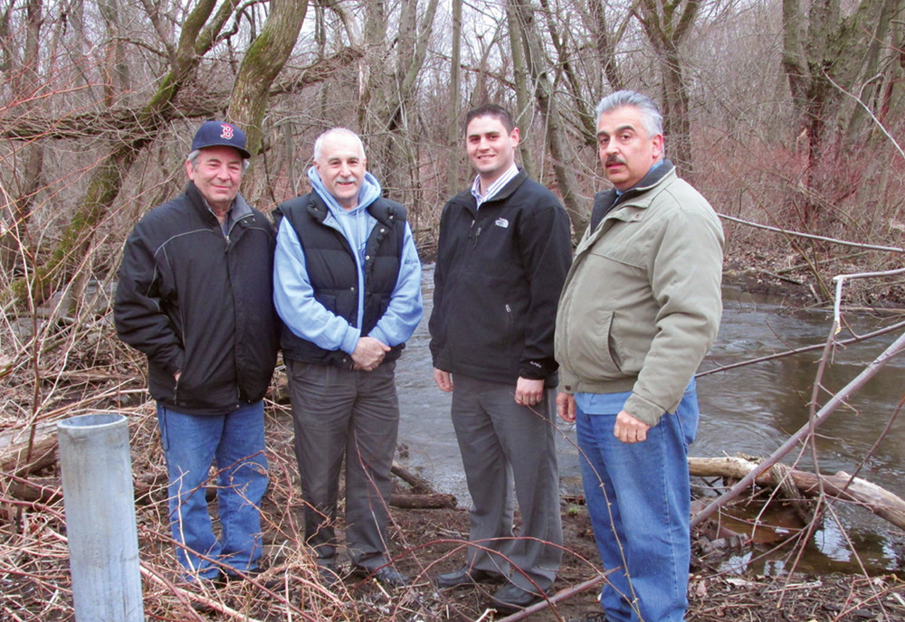 WATERWAY WORKERS: Johnston Mayor Joseph Polisena (second left) and District I Town Councilman Richard J. DelFino III, are flanked by Pat Nero (left), Chairman of the Pawtuxet River Authority and Michael Maddalena (right), a member of the PRA&rsquo;s Board of Directors. Saturday, they&rsquo;ll lead the 3rd Annual Pocasset River Cleanup that the men hope will set a record for volunteers and the amount of debris removed from the prize water way.