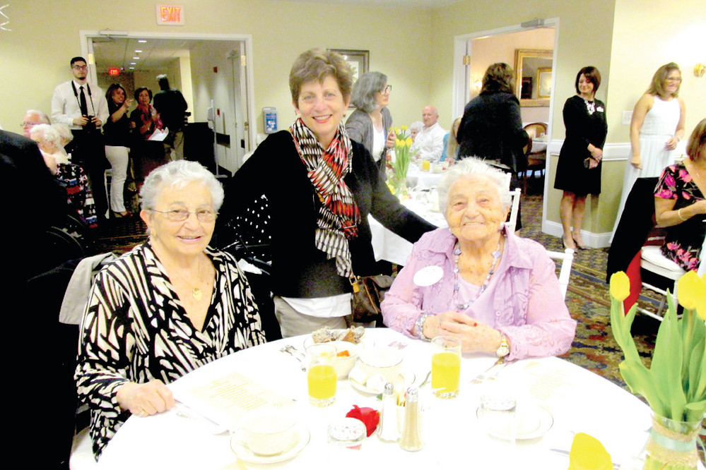 FAMILY FUN: Rose D&rsquo;Orio (seated right), a native Johnstonian, was among the many Centenarians honored during last Friday&rsquo;s RI Governor&rsquo;s Centenarian Brunch held at The Bridge at Cherry Hill. She&rsquo;s joined by her daughter Annette Piscopiello (left) and granddaughter Donna-Lee Wilson.