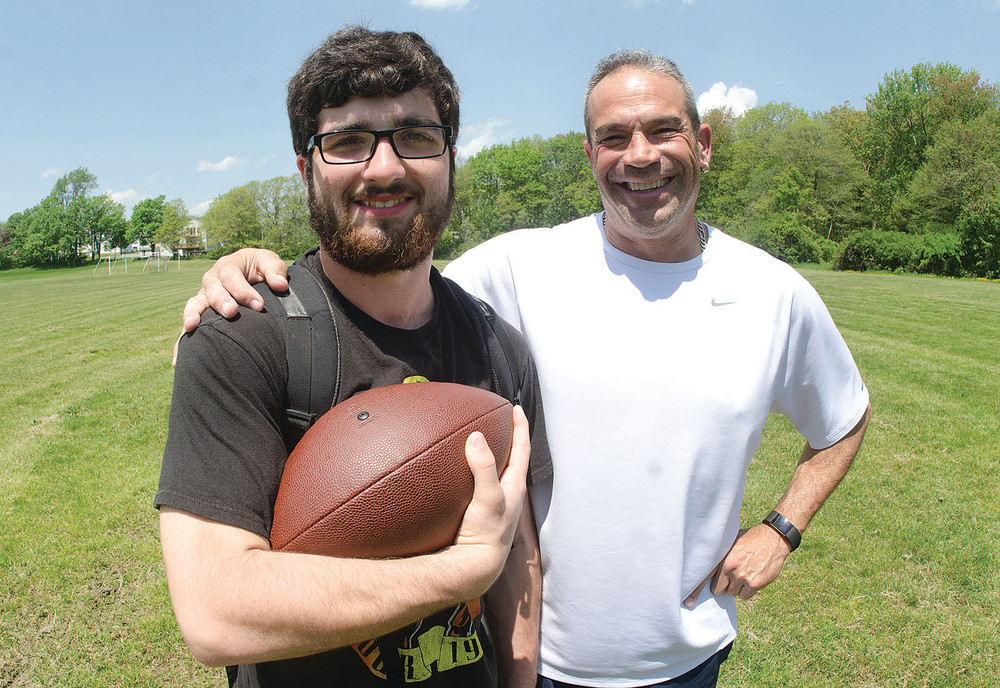 Mt. Hope senior Joe Rioux, left, was named one of Rhode Island's &quot;Golden Dozen&quot; for his academic and athletic prowess. Jow is pictured with Mt. Hope football Coach T.J. DelSanto.