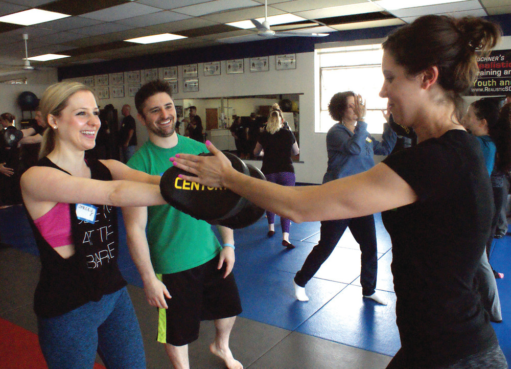 LEARNING TO STRIKE: Sensei Marc Bochner is pictured with (l-r) Stacey Ferranti and Caitlin Reynolds during the free Empower Mom program at Bochner's Realistic Self-Defense on May 21.