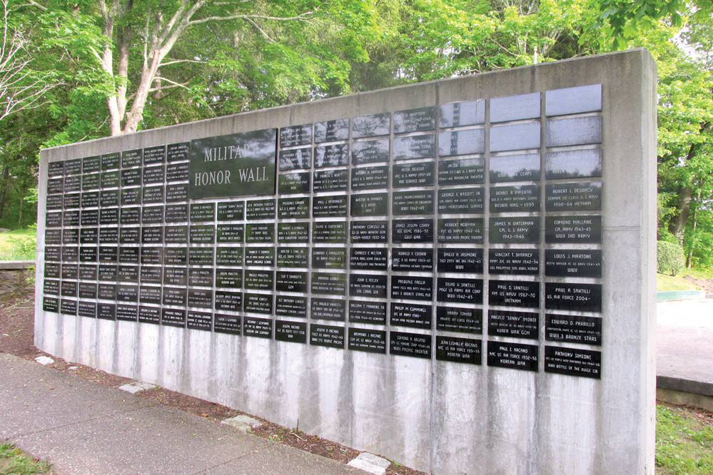 HONOR HALL: People who take in Saturday&rsquo;s annual Memorial Day Service inside Johnston War Memorial Park will be looking at the many names of deceased men and women from the town whose names are affixed to this Honor Wall.