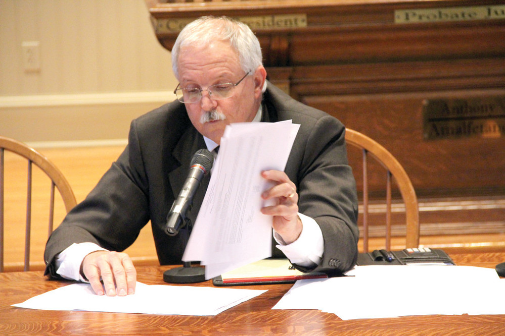 PAGING THROUGHT THE BUDGET: School chief financial officer Anthony Ferrucci looks through the budget to answer a question posed by the council.
