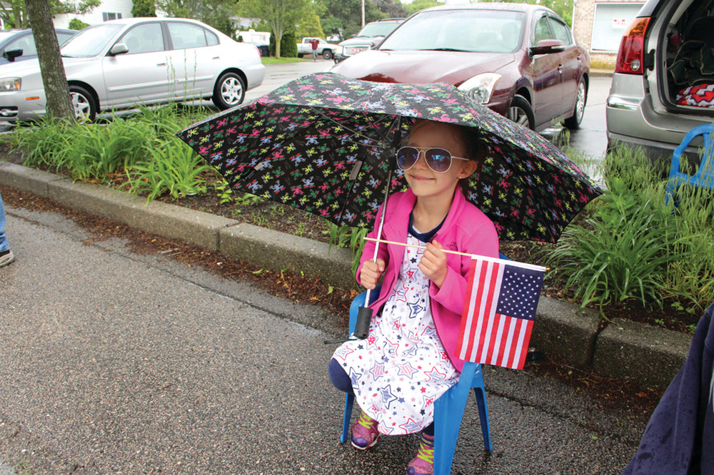 Amber Jones was well prepared for Monday&rsquo;s parade rain or shine. Asked why she set up in a downpour, her mother Emily said, &ldquo;Because we come every year.&rdquo;