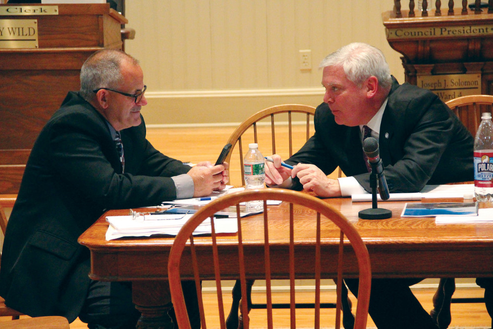 COMPARING NOTES: Chief of staff and public works director David Picozzi and Mayor Scott Avedisian confer during Wednesday&rsquo;s budget hearing.