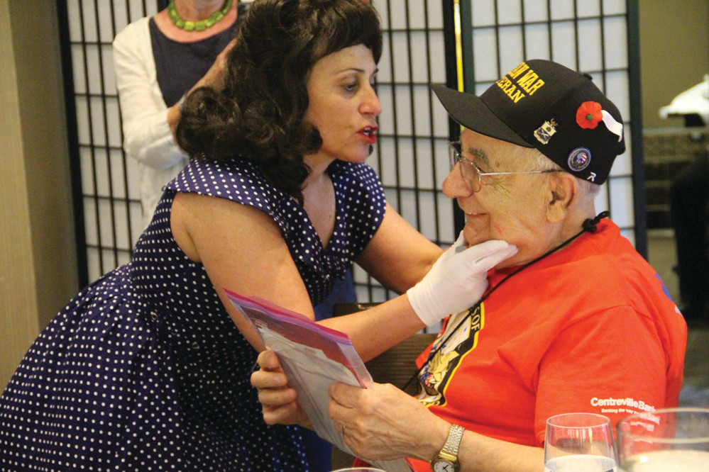 HE GOT A KISS TOO: Korean War veteran and Warwick resident Giovanni Migliaccio was delighted to get mail during mail call that was delivered with a kiss from Julie Latessa.