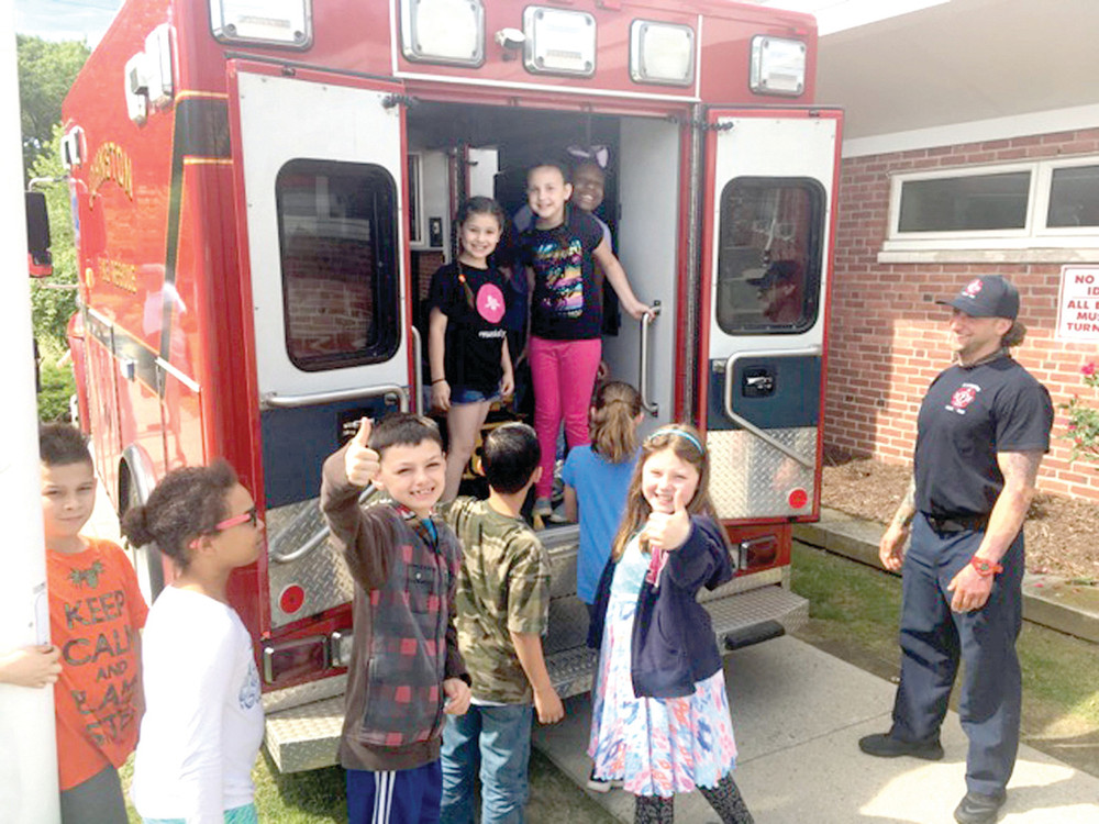 READY TO ROLL: Students had a lot of fun taking a tour of the inside of a Johnston Fire Department Ambulance.