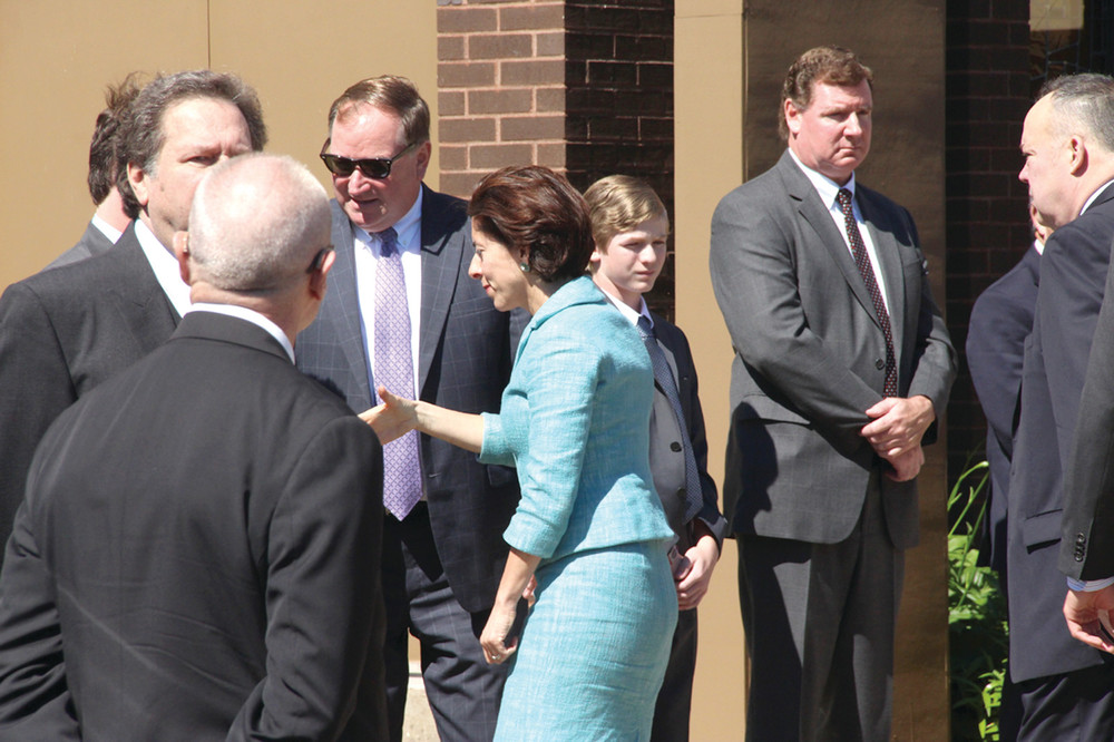 CONDOLENCES: Gov. Gina Raimondo expresses her condolences to members of the McCaffrey family before joining the honor guard at Monday&rsquo;s funeral for former Mayor Eugene McCaffrey.