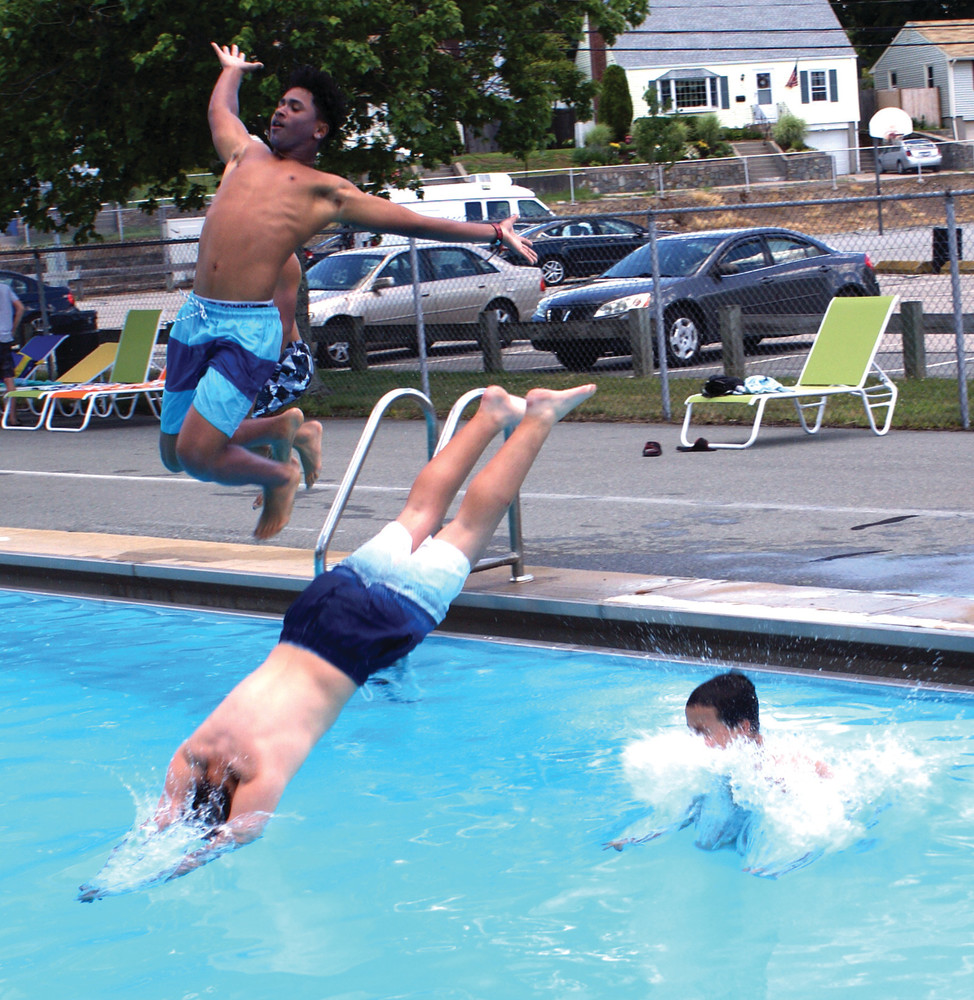 MAKING A SPLASH: Three Park View Middle School students, Fernando Tavares, Arthur Peters and James Garcia, dove or jumped right into the Budlong Pool on opening day.