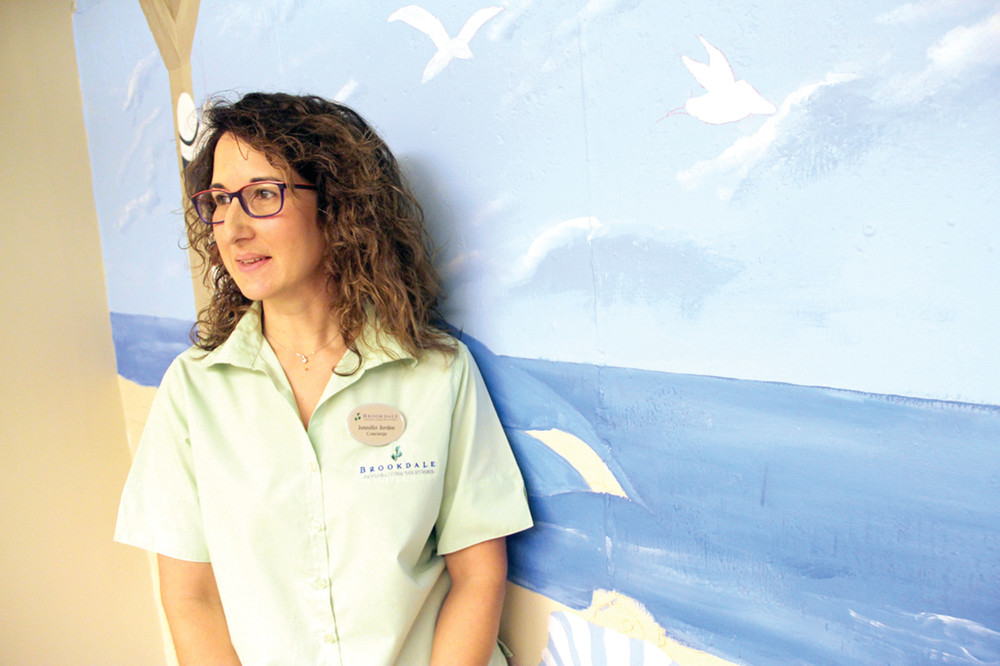 ONE OF THE ARTISTS: Jennifer Jerdee is a member of the Little Rhody Rembrandts and works at Brookdale West Bay has helped paid the laundry room mural.