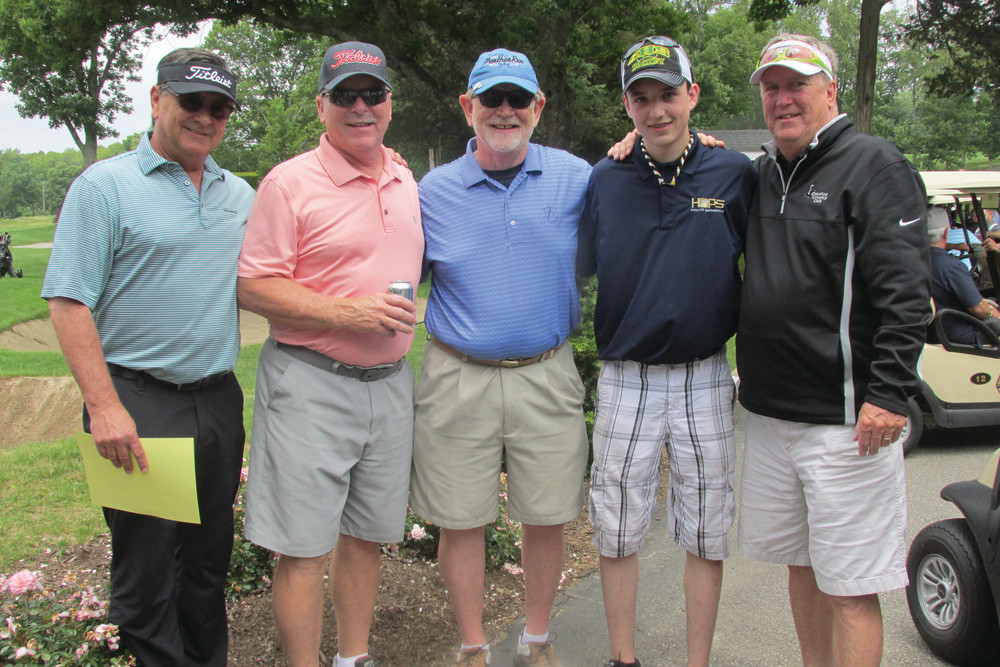 WARM WELCOME: Glocester Country Club PGA pro David Baluik (left) took time from his pre-tourney duties for this photo with the Hopkins brothers, and Shane Hopkins, Ken&rsquo;s grandson, who assisted with on-the-course duties at Monday&rsquo;s tourney. The brothers Hopkins are: Joe, Jim and Ken.