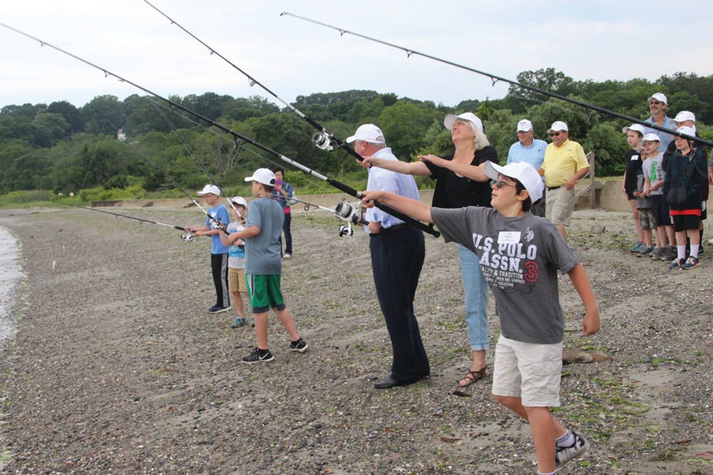 CASTING FOR IDEAS: DEM director Janet Coit is joined by Mayor Scott Avedisian and youth fisherman on the shores of Rocky Point for the opening of the Rhode Island Saltwater Anglers youth fishing camp Tuesday. [Story on page 3]. Coit talks about the park&rsquo;s future in the story below.