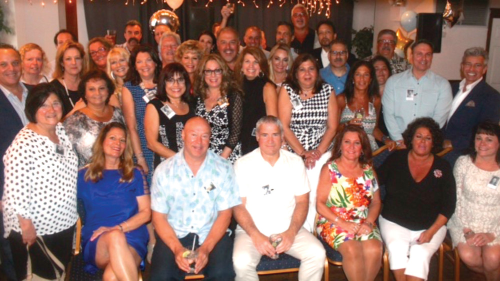 PROUD PANTHERS: The Class of 1977 huddles up for a picture during the reunion.