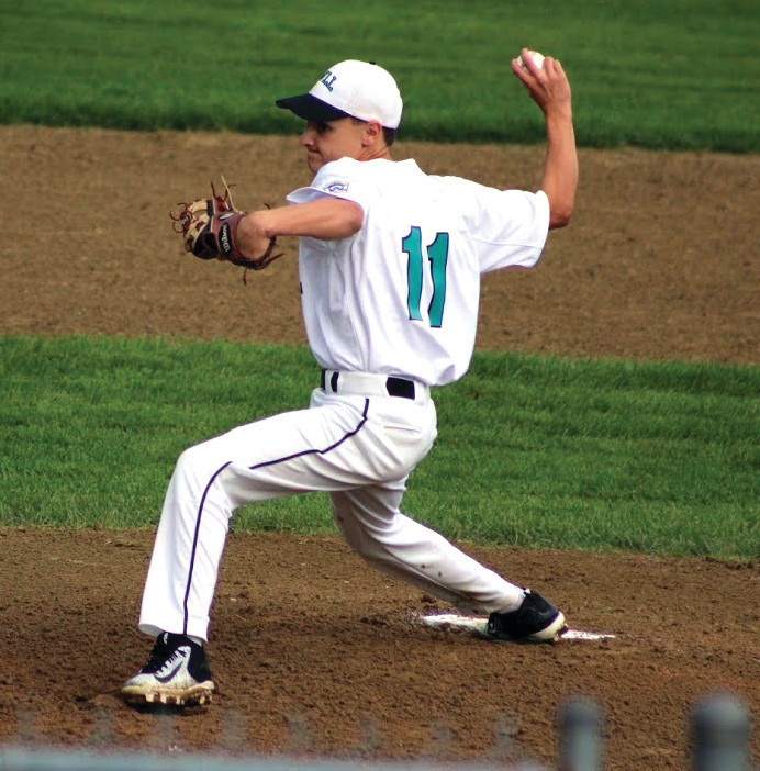 STRIDING: Cranston Western starter Colby Kuzman eyes his target as he throws to the plate.