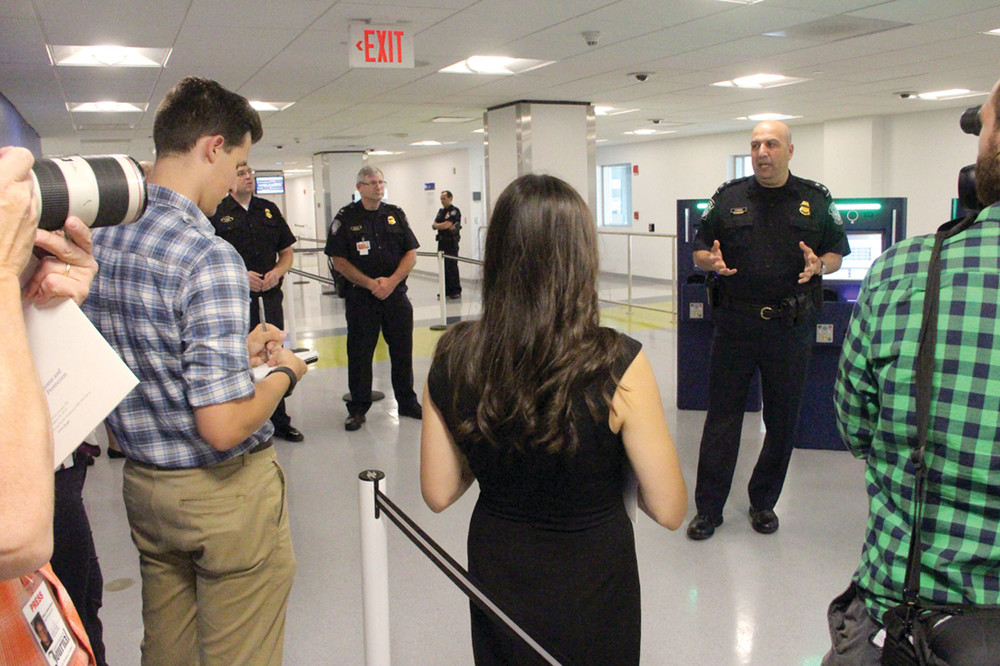 NO QUITE ALL THE DETAILS: William Ferrara, Director of Field Operations for the Boston Field Office of CBP answers media questions during a tour of expanded facilities at Green Airport. For security reasons, Ferrara didn&rsquo;t answer all the questions asked of him.
