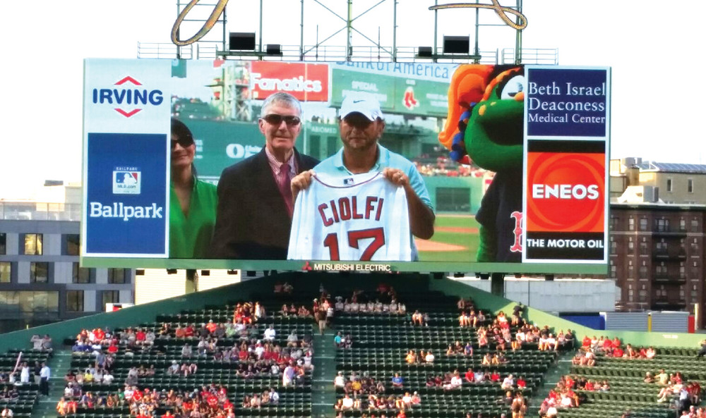 HONORED: David Ciolfi is recognized on the field at Fenway Park last Tuesday as the Rhode Island Little League Volunteer of the Year.