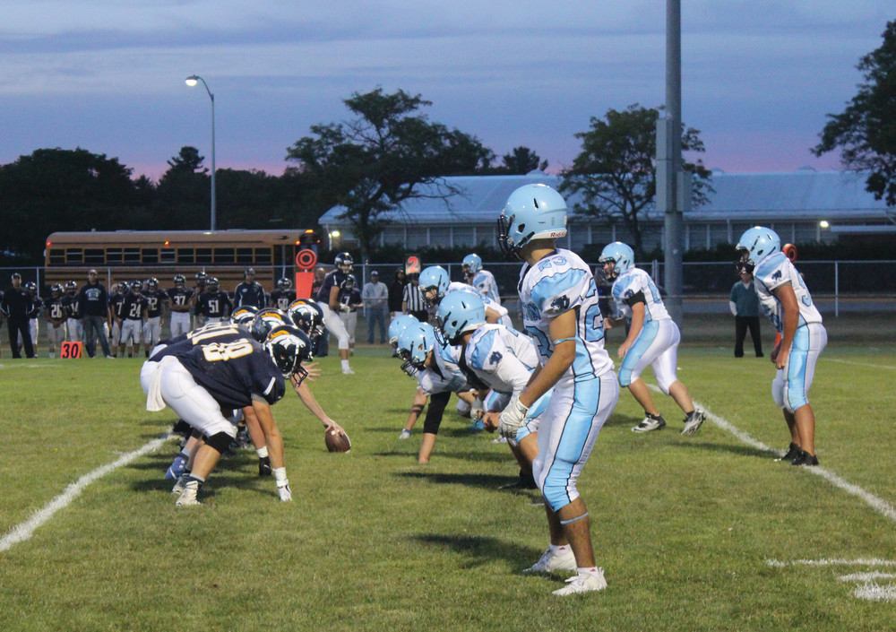 SEASON UNDERWAY: Above, Johnston&rsquo;s defense waits on a Burrillville snap during Friday night&rsquo;s Injury Fund game at Smithfield.