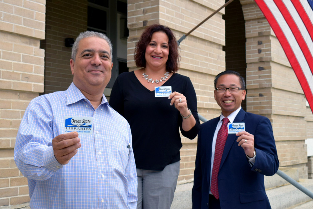 FRESH START: Pictured are Library Director Ed Garcia, Superintendent Jeannine Nota-Masse, and Mayor Allan W. Fung as they proudly present library cards to promote 'Fresh Start,' an initiative to make sure all students in Cranston have a working library card.