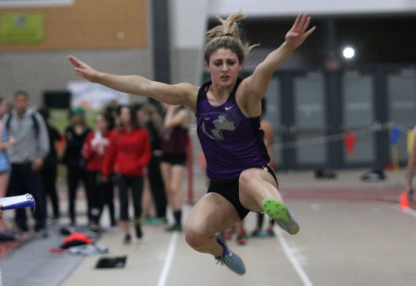 Junior Meghan Oliver leaps through the air during the long jump. She won the event with a jump of 16 feet 4 inches.