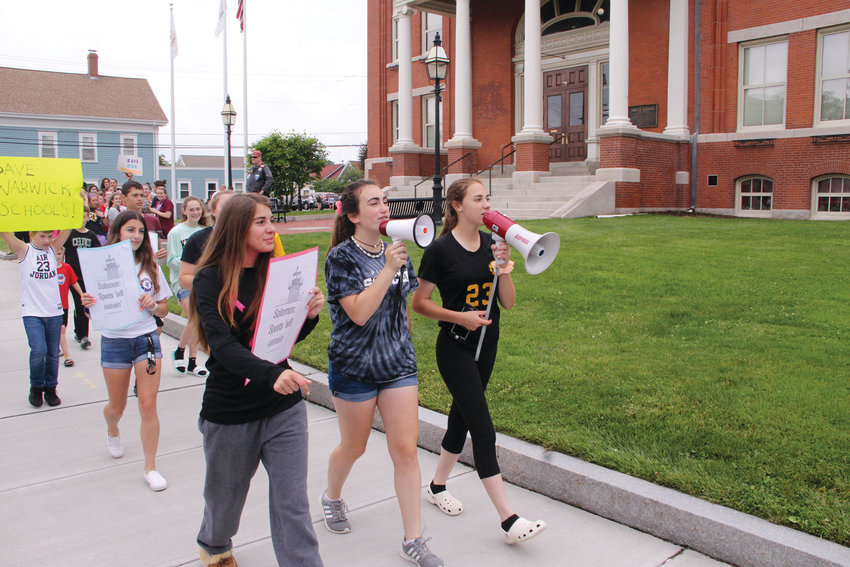 MARCHING ON CITY HALL: Pilgrim girls soccer players Janelle Mixner, Lindsay Flanders and Amelia Murphy led fellow student athletes in Wednesday&rsquo;s demonstration outside City Hall. As the group grew they entered the lobby of City Hall, only leaving after a delegation met with the mayor.