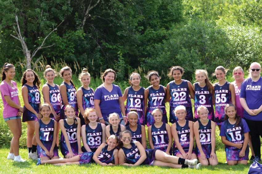 WITH FLARE: Members of the Flare Lacrosse team line up for a group photo. The program focuses on developing girls as players and leaders.