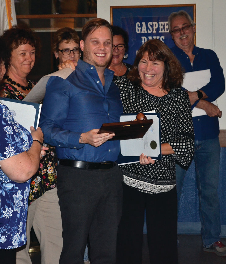PRESIDENTIAL HONOR: New Gaspee Days Committee president Gina Dooley presented past president Ryan Giviens with a plaque to commemorate his years of service.