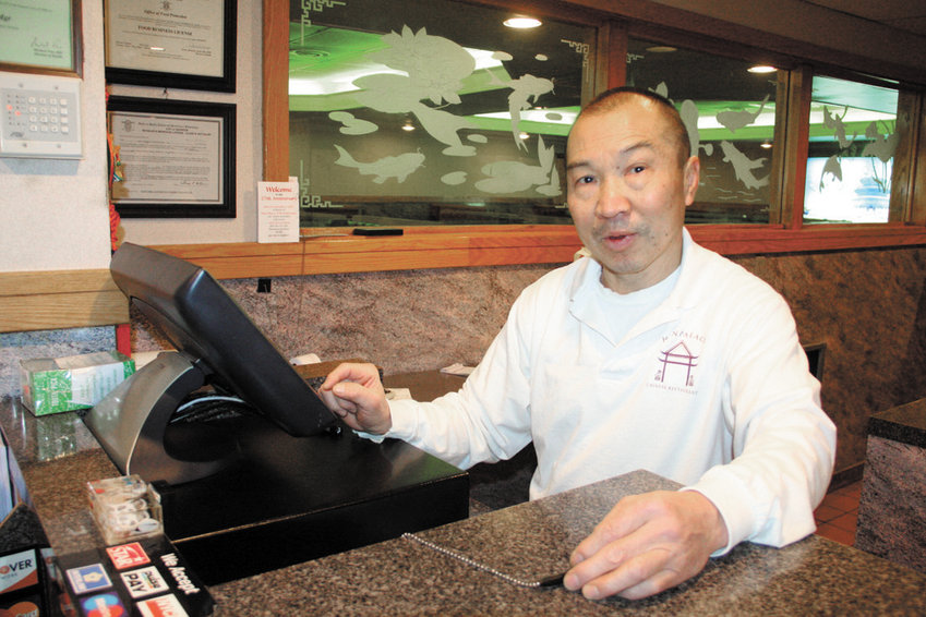 A TRADITION: Keith Lau, co-owner and manager of Han Palace in Warwick, said the holidays are a busy time of year for the restaurant. &ldquo;The Han Palace regulars have made coming here to eat as their tradition even when it&rsquo;s extremely busy here,&rdquo; he said. &ldquo;Christmas is a special holiday for us. It should be for everybody.&rdquo;