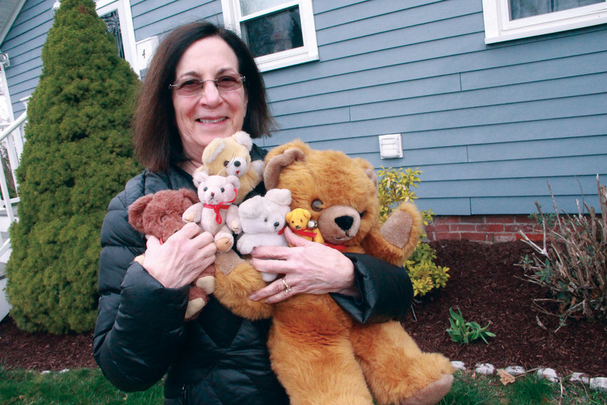 GETTING HER ARMS AROUND IT&hellip;BEARLY: Conimicut Village Association president Ginny Barham put out a notice to the neighborhood of the bear hunt&hellip;and she had plenty from her collection to position in her windows.