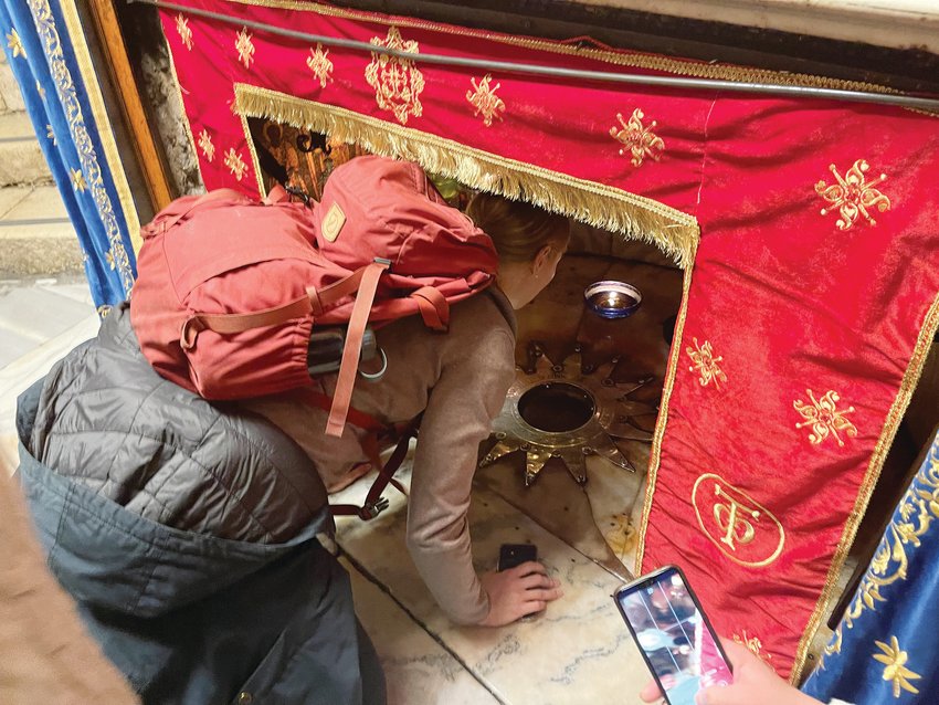 Pilgrims from around the world waited in long lines to reach the grotto of the Church of the Nativity in order to touch the 14-pointed silver star that marks the traditional place of Christ’s birth.