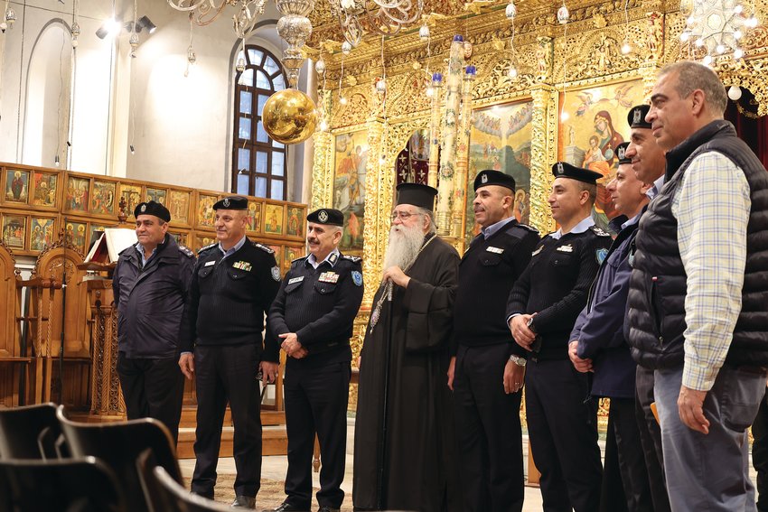 The 141st Patriarch of Jerusalem, Theophilos III, gathers for a photo  in the sanctuary of the Church of  the Nativity in Bethlehem, with members of the protective  force of Jesus’ birthplace.