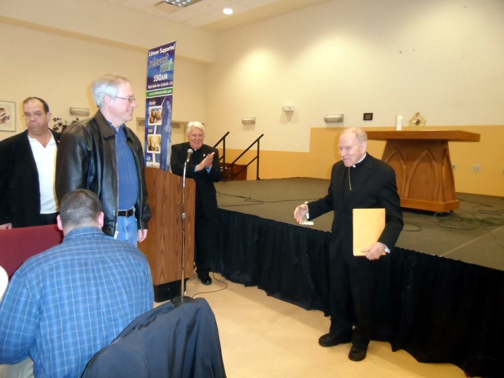 DAY OF RECOLLECTION AN PRAYER: Father Joseph R. Paquette, left, state chaplain for the Rhode Island Knights of Columbus, and Bishop Emeritus Rev. Louis E. Gelineau, present a speaking program on the Year of Faith during the Knights&rsquo; first annual Family Day of Recollection and Prayer on Saturday, Feb. 16 at LaSalette Shrine in Attleboro, Mass. In announcing the Year of Faith, Pope Benedict XVI called for a &ldquo;renewal of the Church through the witness offered by the lives of believers.&rdquo; Through the program, the Knights were invited to take on a greater leadership role during the Year of Faith, to help bring each believer into a deeper relationship with Christ and his church.