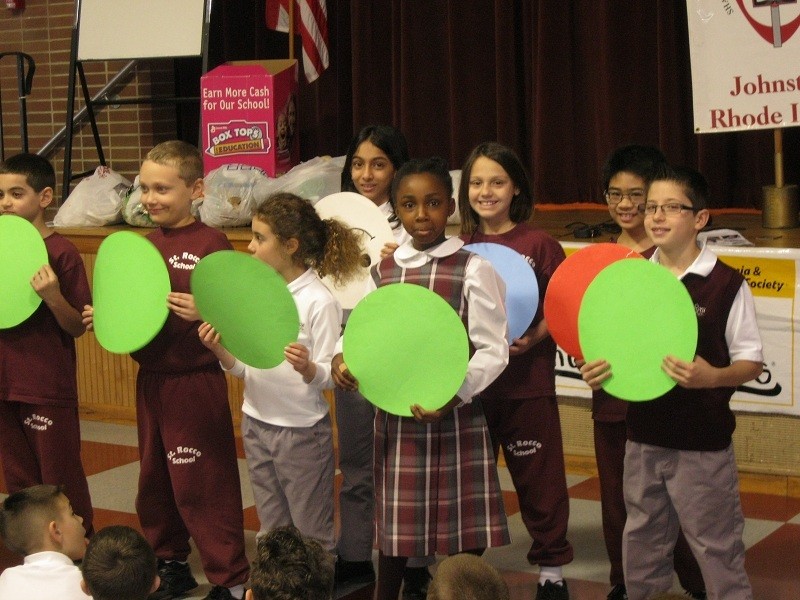 Students from St. Rocco School in Johnston hold up different color circles representing both good and bad blood cells during an assembly to kick-off the Pennies for Patients campaign. Students will bring in their loose change for the next three weeks to benefit the program that informs elementary and secondary school students about the diseases leukemia and lymphoma.?Their donations will help to support research and patient services of the Leukemia &amp; Lymphoma Society. Last year, St. Rocco School raised more than $4,000. During this Year of Faith, Catholics are called to focus on charity, as it is the responsibility of the church to help one&rsquo;s neighbors. As a community, Catholics are called only called to practice love, but to also be of service to our brothers and sisters.