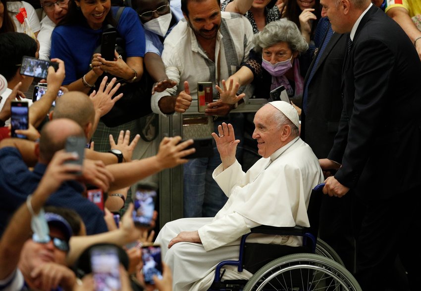 Pope Francis greets the crowd as he leaves his general audience in the Paul VI hall at the Vatican Aug. 3, 2022.
