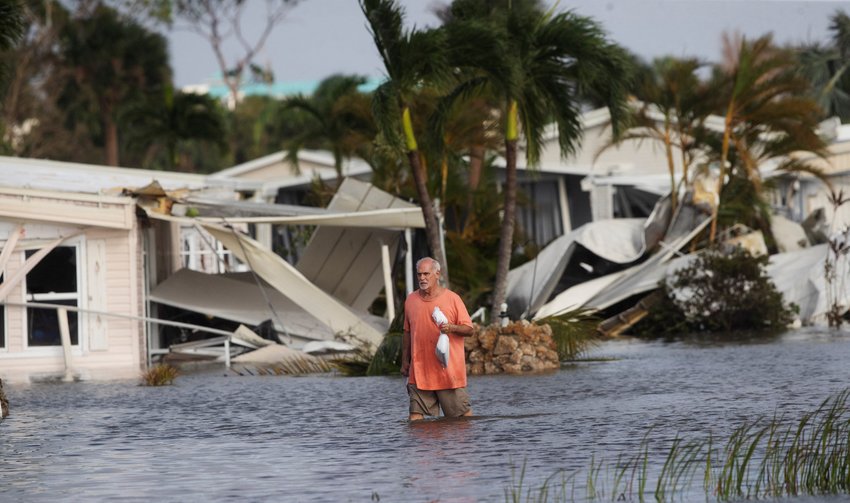Stan Pentz walks in Iona, Fla., Sept. 29, 2022, after Hurricane Ian caused widespread destruction.