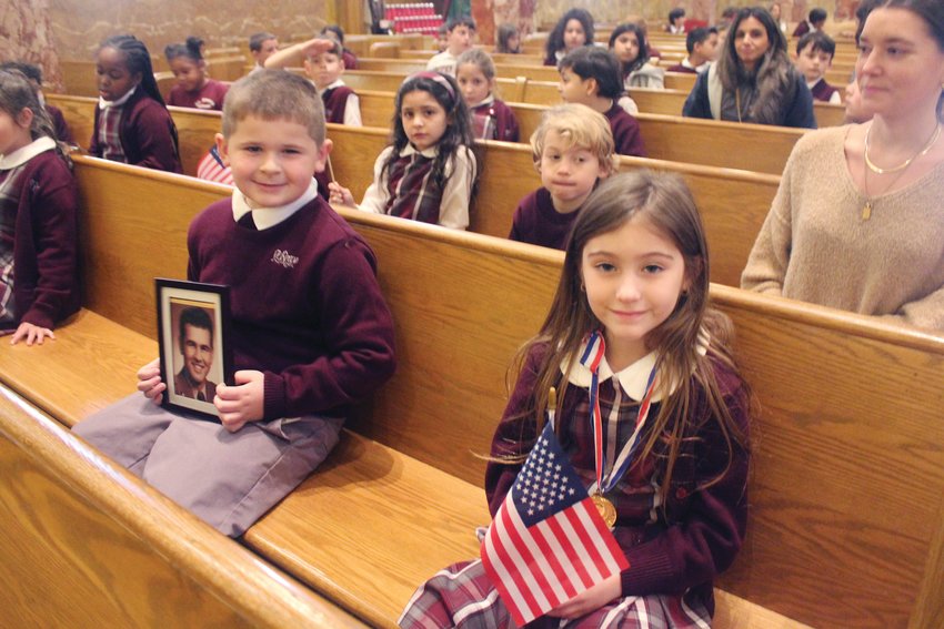 A Veteran&rsquo;s Day prayer service was held on November 9 in St. Rocco Church in Johnston. Students from St. Rocco School read poems that they wrote, carried photos of loved ones, sang patriotic songs, and prayed for all veterans.