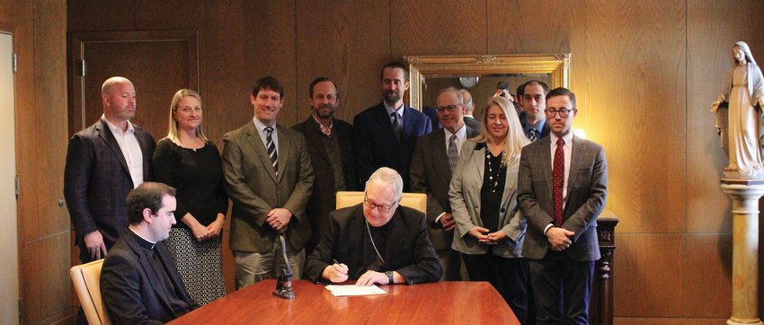 On Nov. 21, the Presentation of the Blessed Virgin Mary, with members of the Board of Directors looking on, Bishop Thomas J. Tobin signed a canonical decree approving the creation of Chesterton Academy of Our Lady of Hope as a new Catholic high school in the Diocese of Providence. The school, which plans to open next fall, will be located in Warwick.